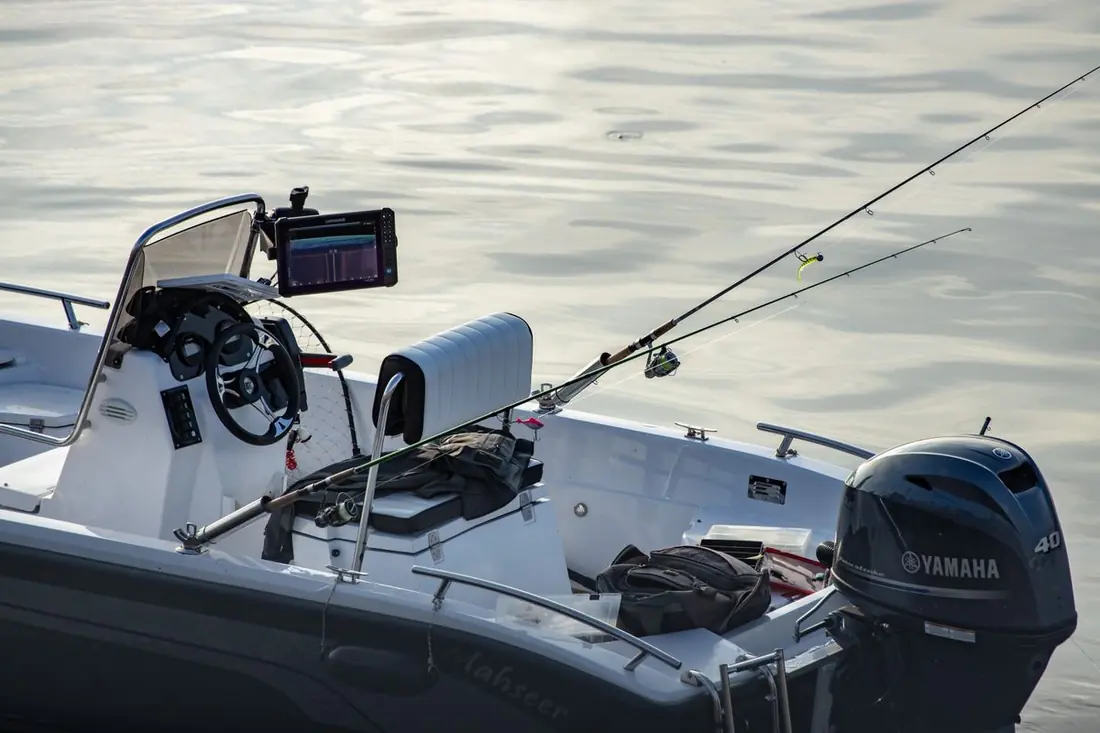 Center console helm with rods and a four-stroke outboard